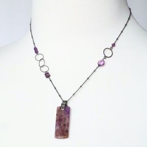 Amethyst colored stone pendant on delicate chain